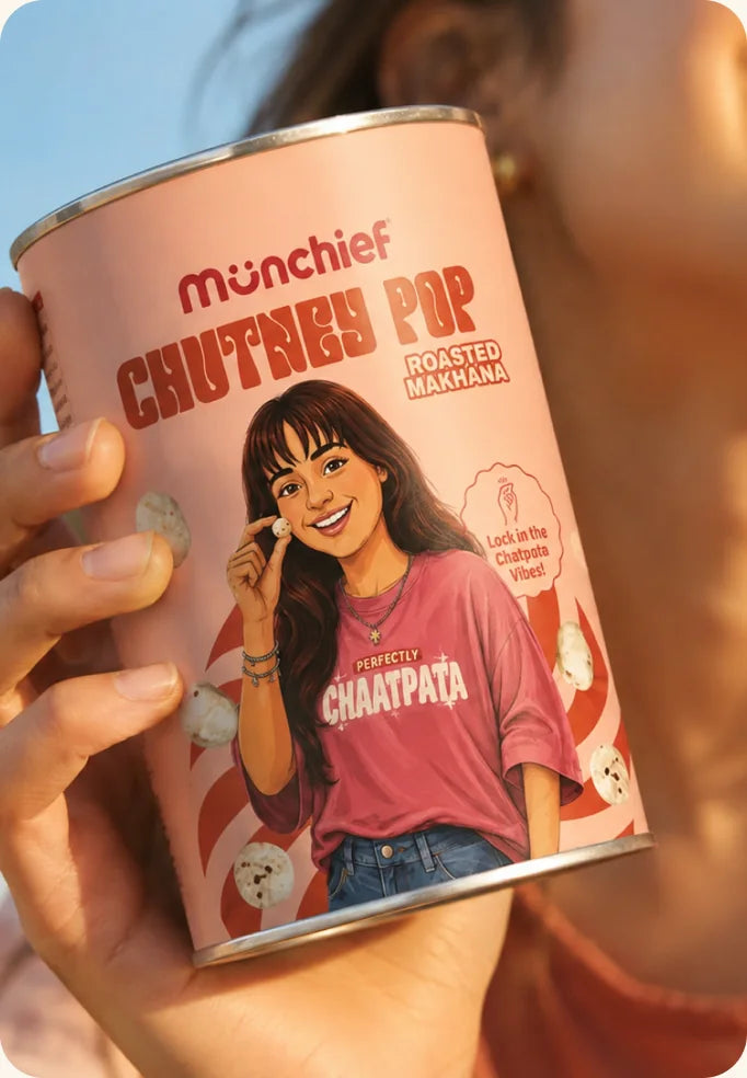 A hand holding a Munchief Chutney Pop can